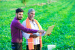 © PRASANNAPIX - indian agronomist with farmer at field