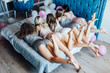© Тарас Нагирняк - Photo of beautiful legs  and ass of the girls lying on the white bed, pajamas partty.