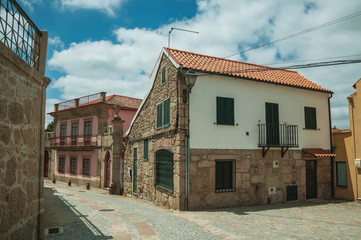 Wall Mural - Old house with stone wall on deserted alley