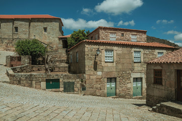 Wall Mural - Houses made of stone with deserted alley