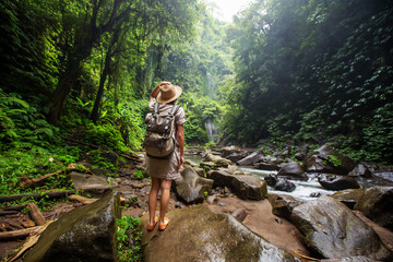 Woman near Nung Nung waterfal on Bali, Indonesia