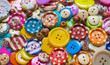 Full frame and selective focus photo of various and colorful sewing buttons
