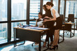 © chokniti - A group of young businessmen are discussing happily. For creative work