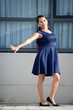 © dtiberio - Youthful Minority Female Having Fun Wearing Dress