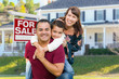 © Andy Dean - Happy Mixed Race Family In Front of House and For Sale Real Estate Sign