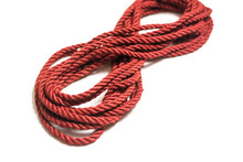 Red Jute Rope For Shibari Isolated On White Background.