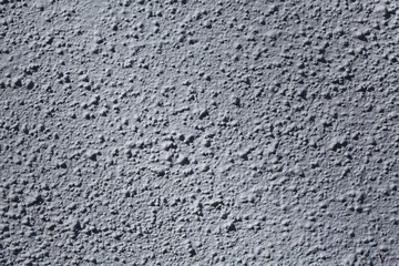 Beautiful background texture of rough bumpy surface. Gray backgrounds.