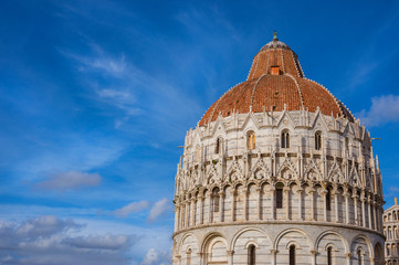 Wall Mural - Pisa Baptistry gothic medieval dome among clouds just before sunset