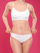 © New Africa - Slim young woman with smooth gentle skin on color background. Beauty and body care concept