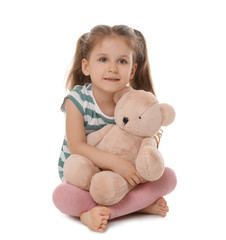 Sticker - Portrait of cute little girl with teddy bear on white background