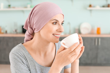 Sticker - Woman after chemotherapy in kitchen at home