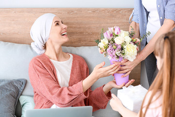 Poster - Family greeting woman after successful treatment at home