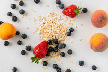 Wall Mural - top vief of different cereal and berries flat lay on table, healthy vegan food