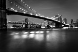 Fototapeta  - Black and White  Picture of the Brooklyn Bridge Lighted Up At Night