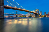 Fototapeta Nowy Jork - Long Exposure Picture of the Brooklyn Bridge Lighted Up At Night