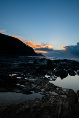 Canvas Print - Waves and Rocks at Beach at Sunrise