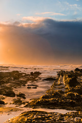 Canvas Print - Waves and Rocks at Beach at Sunrise