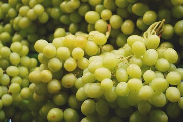 pile of grape on a market background close up