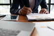 © ntinai - Businessmen, finance, accounting work, checking accounts, using calculators and finding information