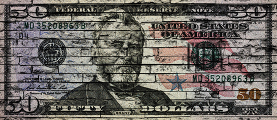 US Dollar banknote on a brick wall