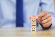 © A Stockphoto - customer pressing smiley face emoticon on wood cube, Service rating, satisfaction concept.
