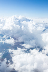 Wall Mural - Clouds and sky from airplane window view