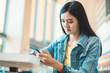 © anon - Attractive Asian woman drinking coffee.cheerful girl drinking coffee or tea in morning