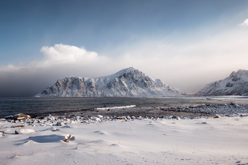 Wall Mural - scenery of snow mountain range with overcast sky in winter