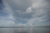 Fototapeta Morze - Stormy clouds forming above the Amazon river in the Peruvian rain forest