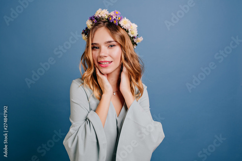 Indoor Portrait Of Carefree Young Woman With Shiny Blonde Hair