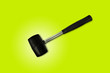 © Joe - Close up black rubber mallet isolated on bright green background. Rubber hammer is a construction tool. Clipping path.