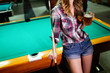 © NDABCREATIVITY - Young smiling girl playing billiard in club