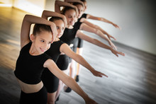 Group Of Fit Happy Children Exercising Dancing And Ballet In Studio Together