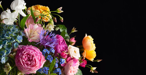 Beautiful bunch of colorful flowers on black background