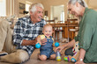 © Rido - Cute little boy playing with grandparents
