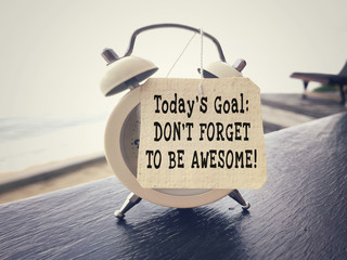 Wall Mural - Motivational and inspirational wording - Today’s Goal: Don’t Forget To Be Awesome written on a paper. Blurred styled background.