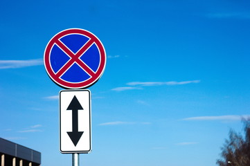 road signs on background of blue sky