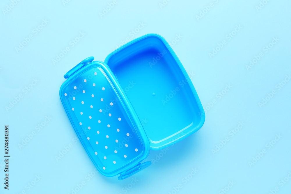 Plastic lunch box on color background