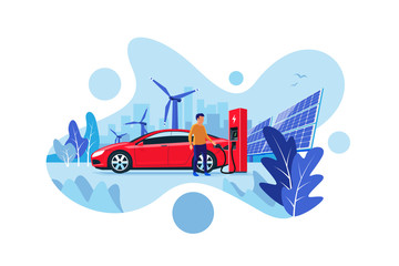 Wall Mural - Modern flat vector illustration of a red electric car charging at the charger station with renewable energy fuel. Charge with solar panels and wind power generation. City skyline in the background.