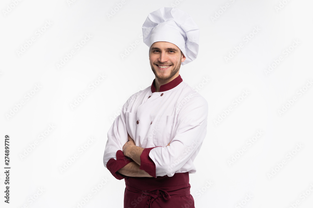 Portrait of positive handsome chef cook in beret and white outfit isolated on white background. - obrazy, fototapety, plakaty 