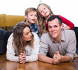 © JackF - Smiling family enjoying evening together at home