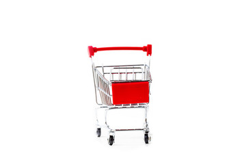 Miniature shopping cart isolated on white background.