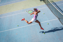 Female Tennis Player Hits The Ball With Forehand Drive Volley.