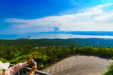 Wall Mural - Kagoshima, Kagosima city / Japan - 2019.05.12 : landscape of Kinkowan bay and Kagoshima city  from Yunohira observation point in Kagoshima Japan 