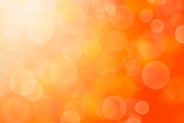 Wall Mural - Orange abstract background blur with bokeh light effect.