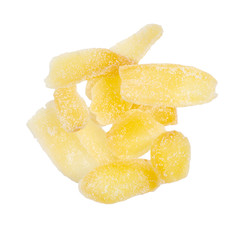 Ginger candied fruit, dried ginger with sugar on a white background, top view