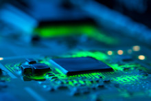 Electronic Circuit Board Close Up With Green Backlight And A Light Haze