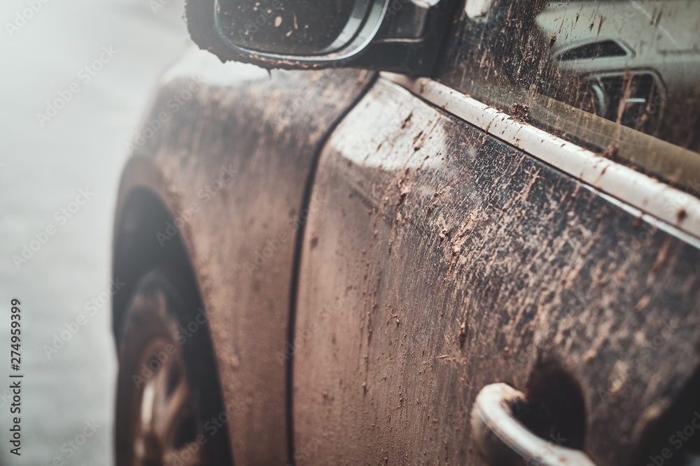 Closeup photo shoot of dirty car's mirror, door and window, splash and texture of mud on silver car. - obrazy, fototapety, plakaty 