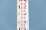 Fototapeta Mapy - Thermometer during hot weather with sky in background