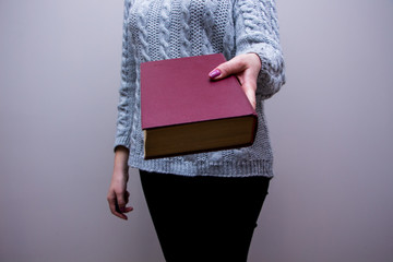 Woman with book in  hands 